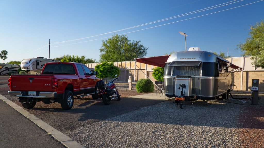 Charlie (Airstream) and Clifford (Truck) w/motorcycle at our camp site