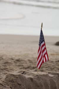 American flag on the beach