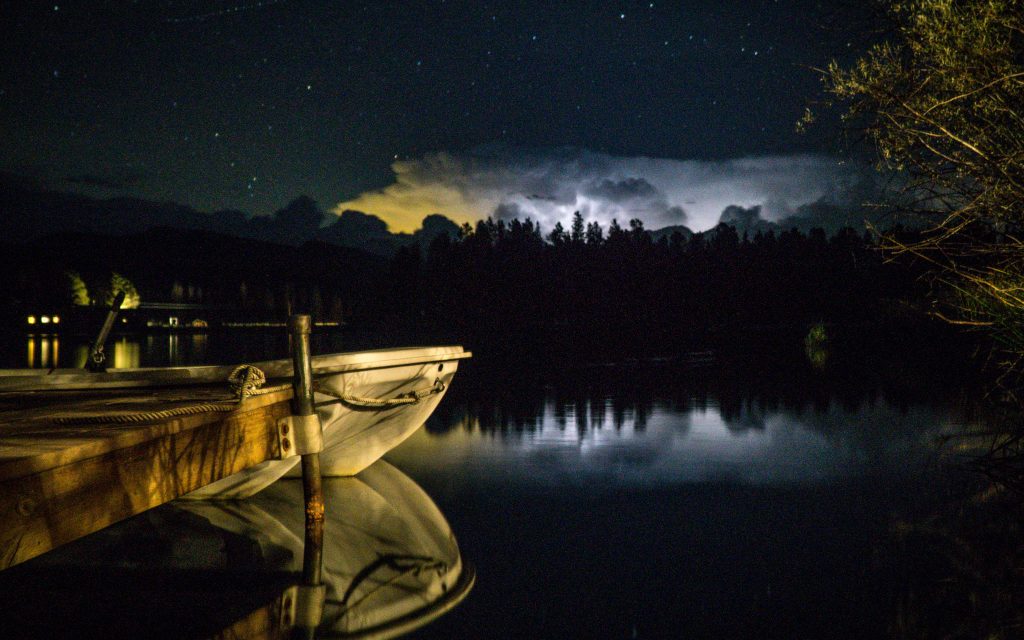 From our dock on a smaller lake, thunderstorms in the distance